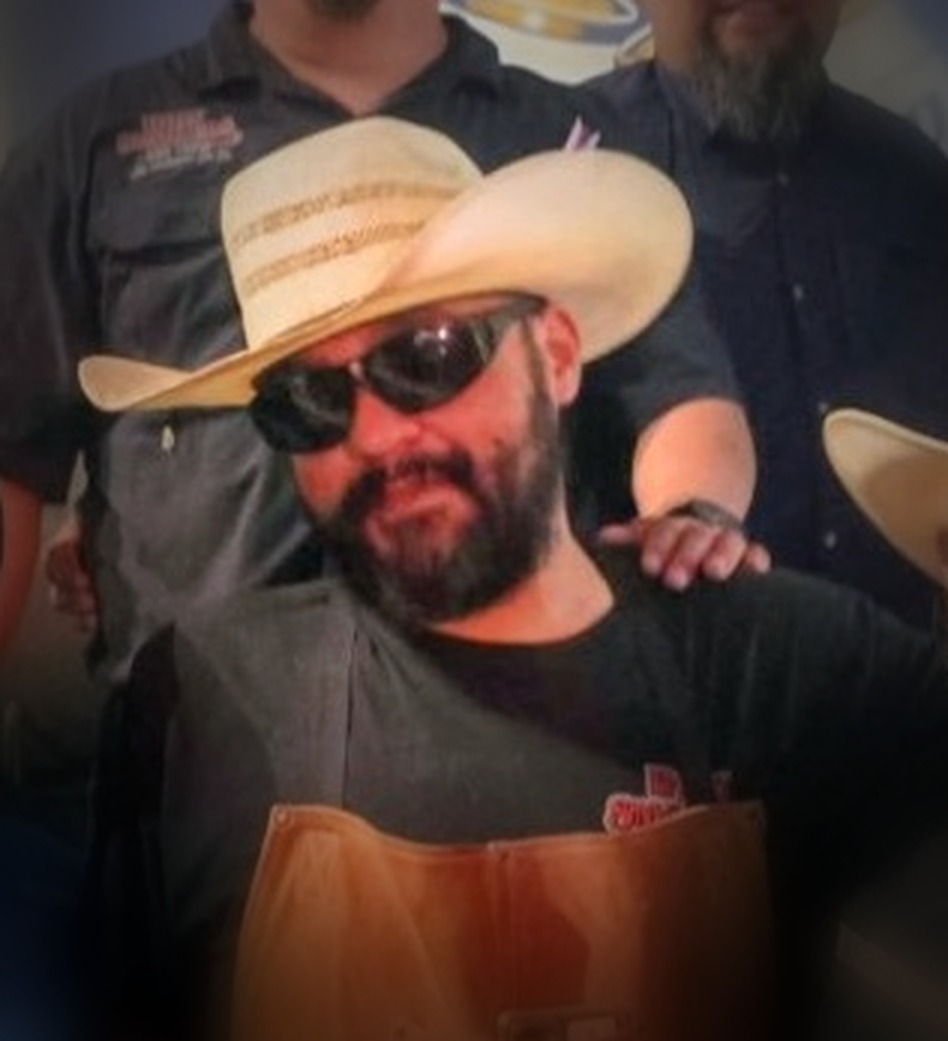Juan — known around the Valley as Gizmo — wearing his straw cowboy hat